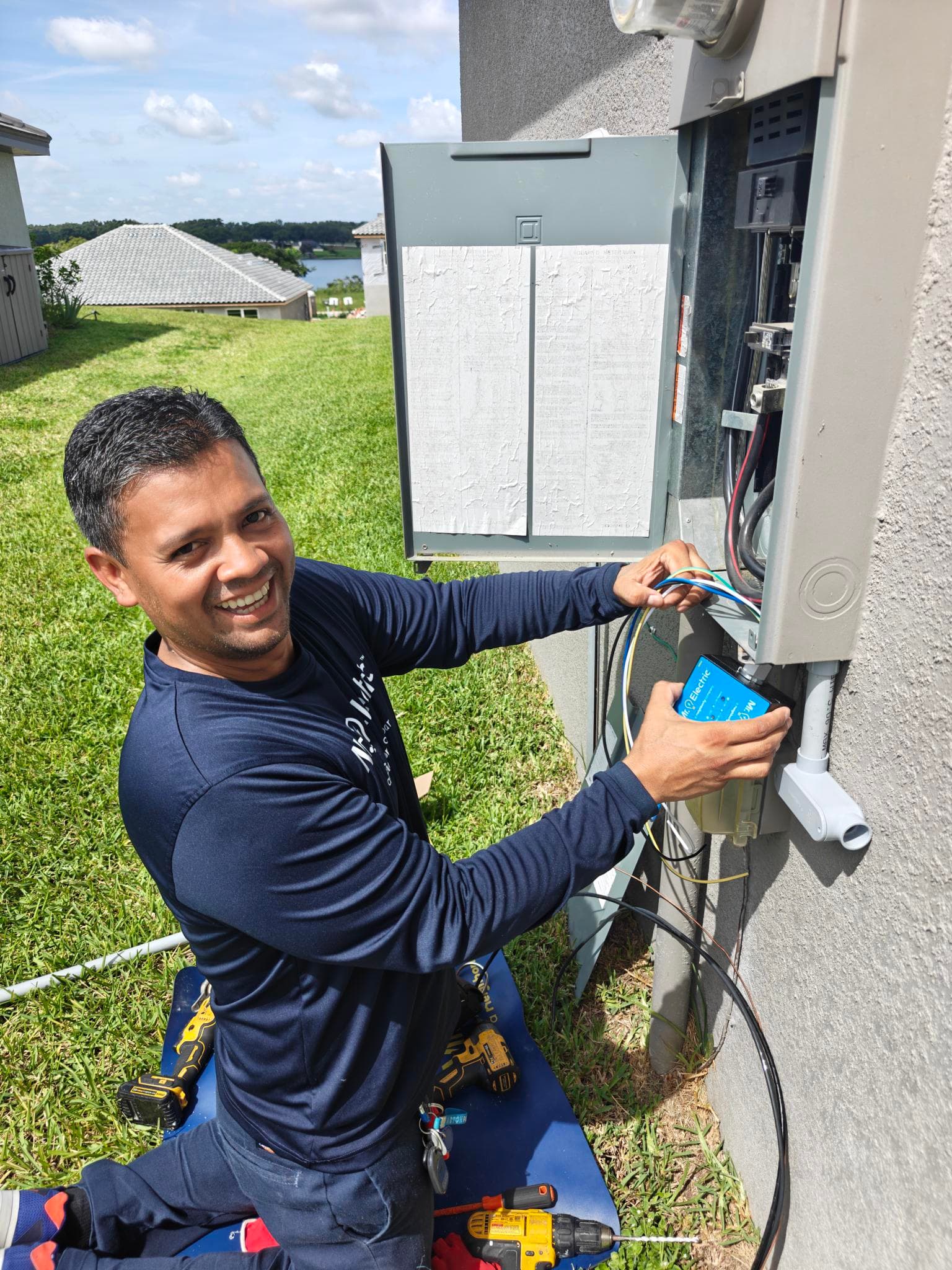 Mr. Electric technician working on an exterior residential electrical panel in Winter Haven