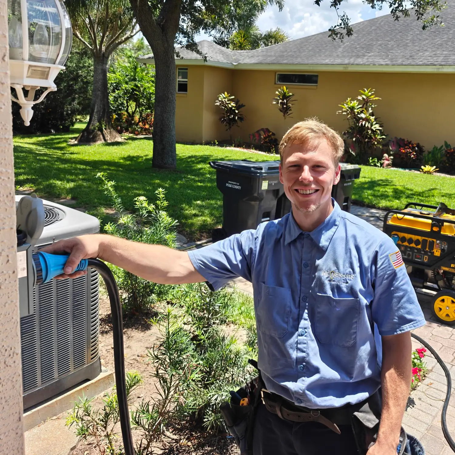 Mr. Electric of Winter Haven technicians working on exterior electrical equipment