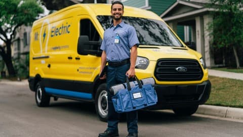 Mr. Electric technician with service van