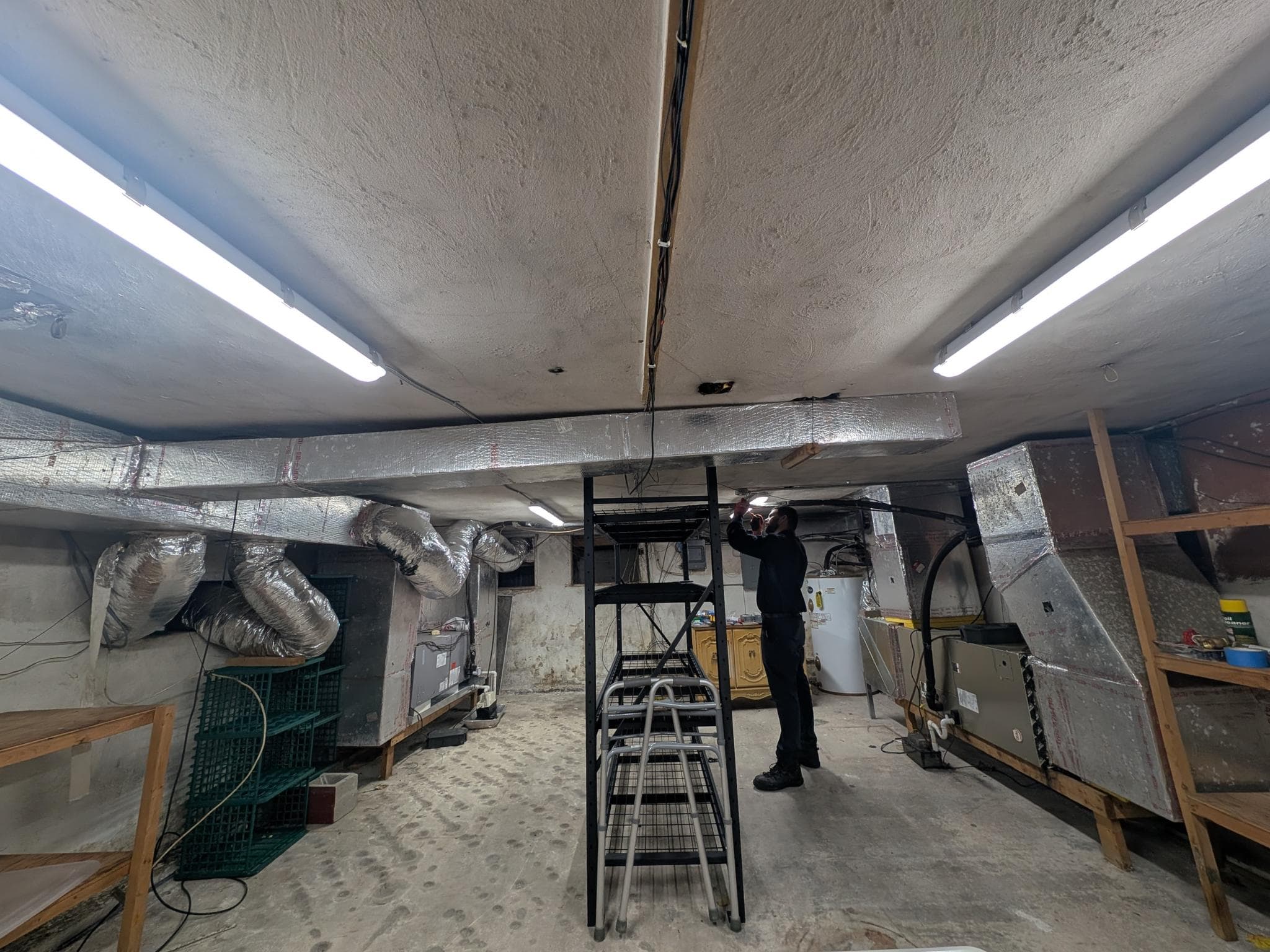 Electrical lighting work completed in an attic space